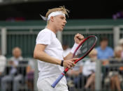 Canada's Denis Shapovalov celebrates winning a point against Germany's Philipp Kohlschreiber during the men's singles first round match on day two of the Wimbledon Tennis Championships in London, Tuesday June 29, 2021. (AP Photo/Alastair Grant)