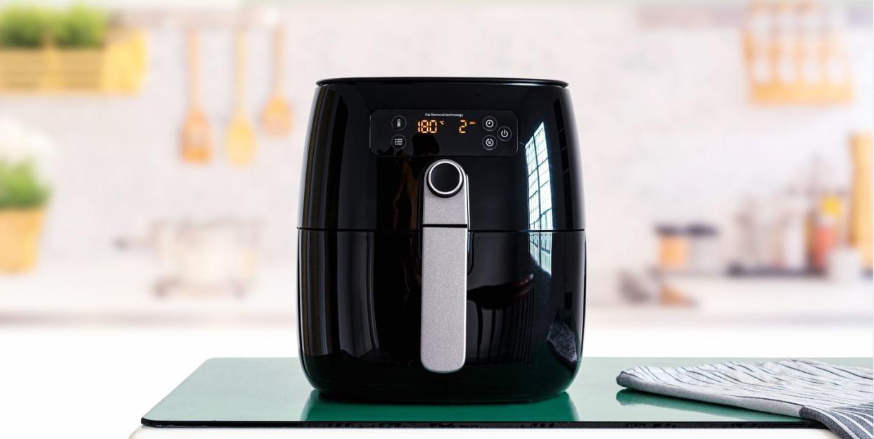 air fryer machine cooking potato fried in kitchen lifestyle of new normal cooking