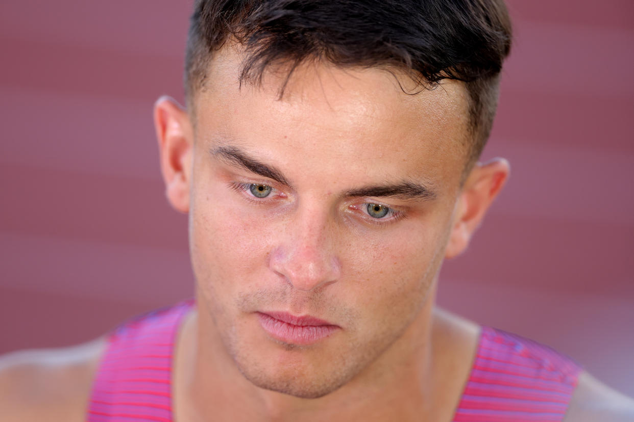 EUGENE, OREGON - JULY 17: Devon Allen of Team United States speaks to reporters after being disqualified from the Men's 110m Hurdles Final on day three of the World Athletics Championships Oregon22 at Hayward Field on July 17, 2022 in Eugene, Oregon. (Photo by Carmen Mandato/Getty Images)