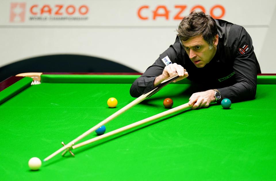 Ronnie O’Sullivan in action against his quarter-final opponent Luca Brecel (PA)