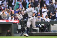 New York Yankees' Anthony Volpe gestures skyward as he nears home on a three-run home run against the Seattle Mariners during the third inning of a baseball game Tuesday, May 30, 2023, in Seattle. (AP Photo/Caean Couto)