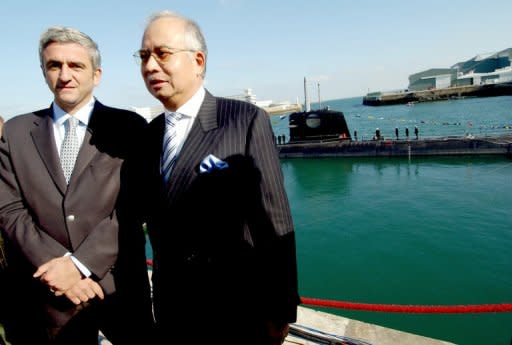 File photo shows French Defence Minister Herve Morin (L) and Najib Razak, then Malaysian Deputy PM and Defence Minister, at the launch of the first of two Scorpene submarines ordered by Malaysia in 2007. Earlier this year, a French court started hearing a complaint launched by Suaram, accusing Najib and others over a 2002 deal to buy two submarines from France