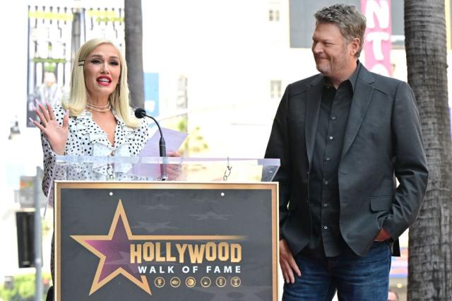 US singer Gwen Stefani (L) speaks as US country singer and television personality Blake Shelton listens during his Hollywood Walk of Fame Star ceremony, in Hollywood, California, on May 12, 2023. (Photo by Frederic J. BROWN / AFP) (Photo by FREDERIC J. BROWN/AFP via Getty Images)