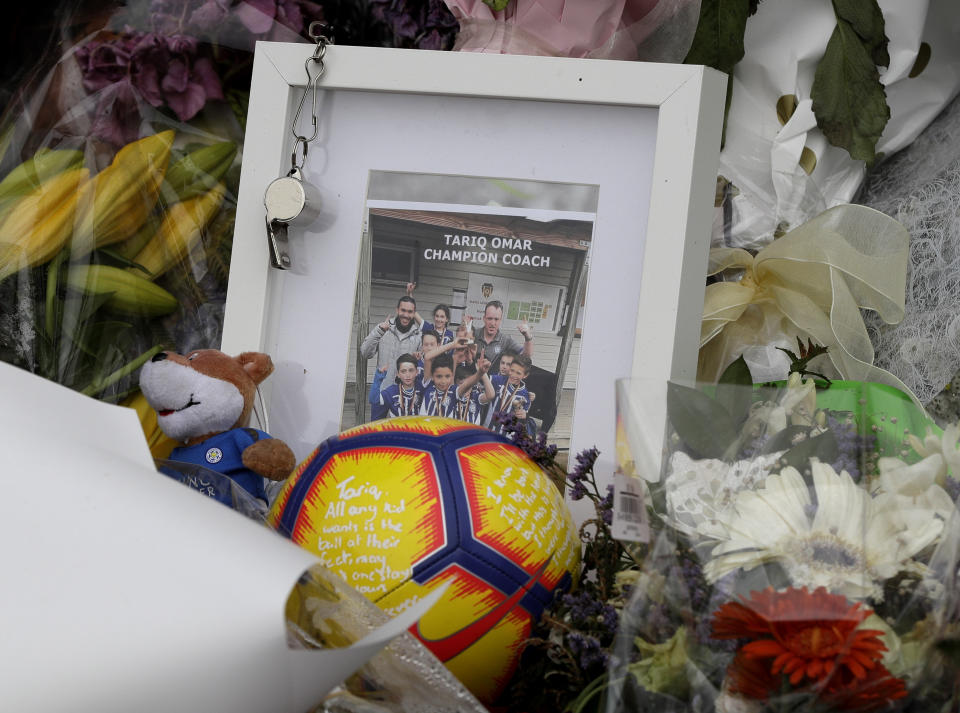 A tribute for mosque shooting victim Tariq Omar is placed at the Botanical Gardens in Christchurch, New Zealand, Thursday, March 21, 2019. Thousands of people were expected to come together for an emotional Friday prayer service led by the imam of one of the two New Zealand mosques where 50 worshippers were killed in a white supremacist attack on Friday March 15. (AP Photo/Mark Baker)