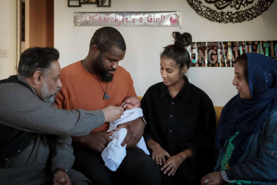 New parents Mariyah and Jermaine with daughter Rumi and Mariyah's parents. (BBC/Workerbee TV)