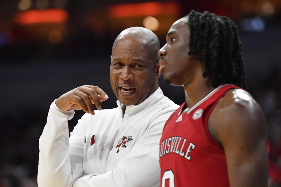 Louisville head coach Kenny Payne talks with guard Mike James (0) during the second half of an NCAA college basketball game in Louisville, Ky., Monday, Nov. 6, 2023. Louisville won 94-93. (AP Photo/Timothy D. Easley)