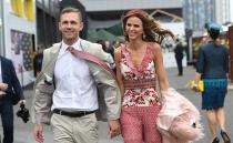 <p>Pictured: Punters brave wild weather as Melbourne Cup festivities get underway</p>