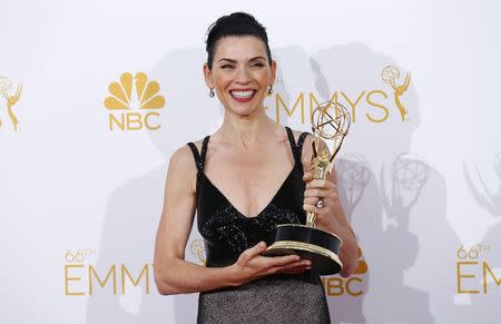 Julianna Margulies poses backstage with her award for Outstanding Lead Actress in a Drama Series for the CBS series "The Good Wife" at the 66th Primetime Emmy Awards in Los Angeles, California August 25, 2014. REUTERS/Mike Blake