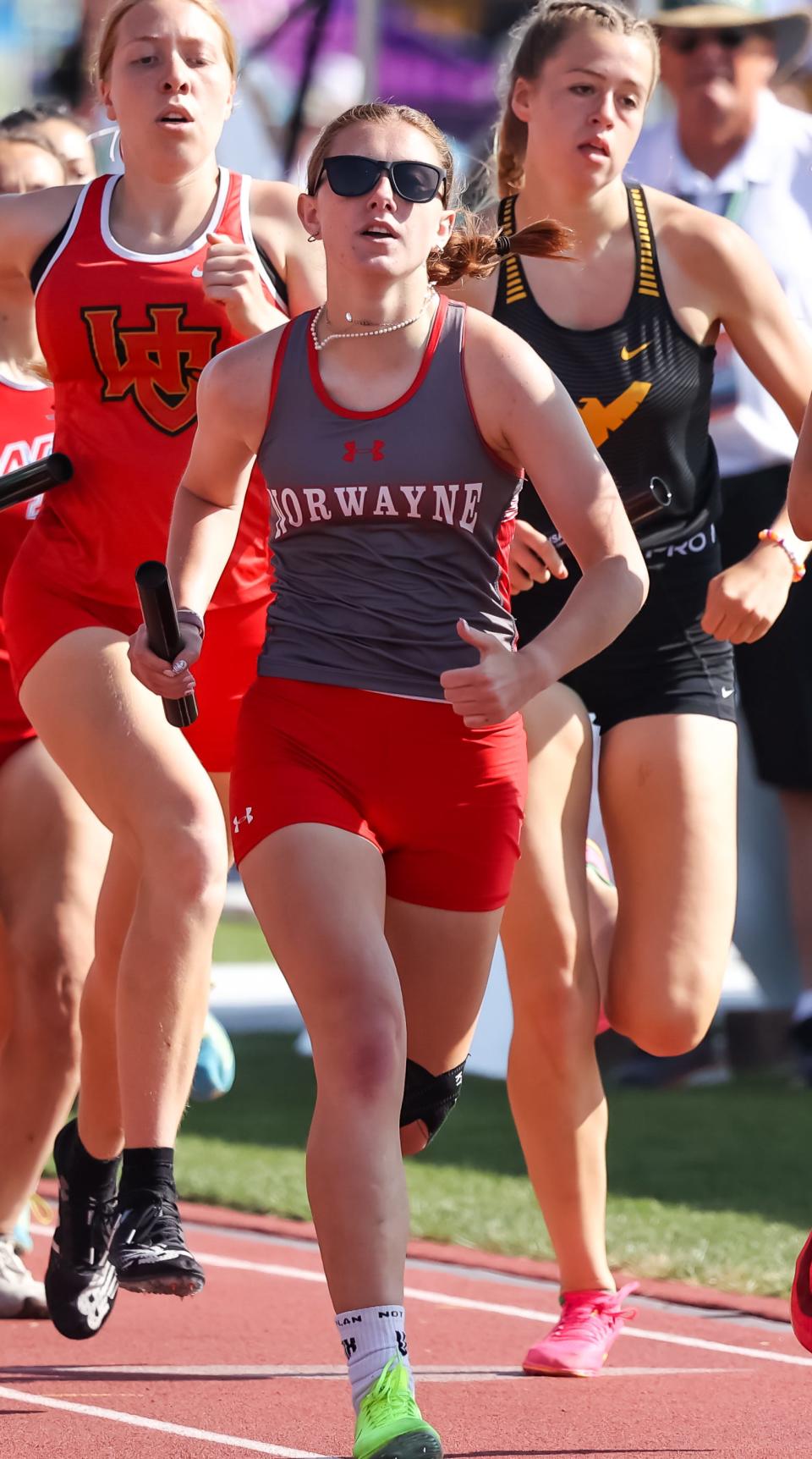 Annabel Stanley works her way through a crowd here in the opening leg of the 3200 relay for Norwayne.