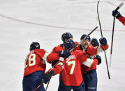 Florida Panthers center Sam Reinhart, right, celebrates scoring the game-winning goal over the Toronto Maple Leafs during overtime of Game 3 of an NHL hockey Stanley Cup second-round playoff series, Sunday, May 7, 2023, in Sunrise, Fla. (AP Photo/Michael Laughlin)