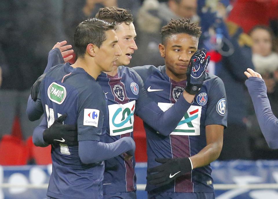 PSG's Julian Draxler, center, celebrates with his teammates Angel di Maria, left, and Christopher Alan Nkunku after scoring 7- 0 during a French Cup soccer match Paris Saint-Germain against Bastia at Parc des Princes stadium in Paris, Saturday, Dec. 7, 2017. (AP Photo/Michel Euler)