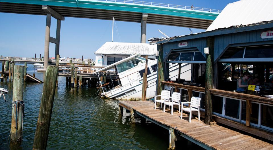 This is a view of "Bachelor Pad" looking north toward the Mantanzas Bridge that connects Fort Myers Beach to the mainland. Customers in the restaurant have gotten used to the boat sharing breath-taking backdrop space with the bridge.