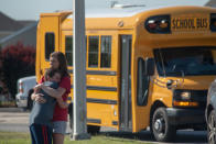 <p>A student and adult embrace outside Noblesville West Middle School after a shooting at the school on May 25, 2018 in Noblesville, Ind. (Photo: Kevin Moloney/Getty Images) </p>