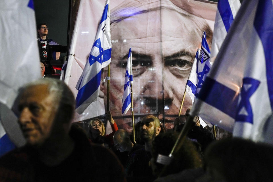 Israelis protest against plans by Prime Minister Benjamin Netanyahu's government to overhaul the Israel's judicial system, in Tel Aviv, Israel, Saturday, March 18, 2023. (AP Photo/Ohad Zwigenberg)