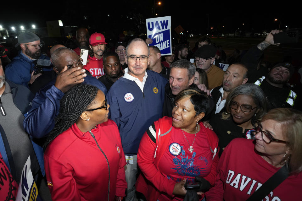 United Auto Workers President Shawn Fain stands with UAW members striking at Ford's Michigan Assembly Plant in Wayne, Mich., early Friday, Sept. 15, 2023. (AP Photo/Paul Sancya)