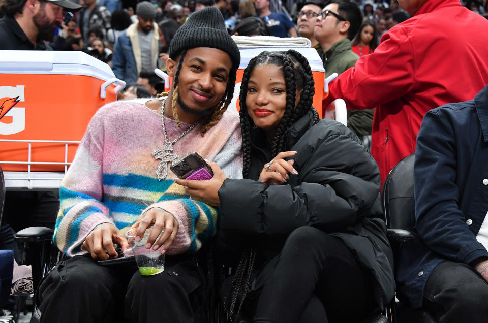 LOS ANGELES, CALIFORNIA - DECEMBER 14: Halle Bailey (R) and boyfriend DDG attend a basketball game between the Los Angeles Clippers and the Golden State Warriors at Crypto.com Arena on December 14, 2023 in Los Angeles, California. NOTE TO USER: User expressly acknowledges and agrees that, by downloading and or using this photograph, User is consenting to the terms and conditions of the Getty Images License Agreement. (Photo by Allen Berezovsky/Getty Images)