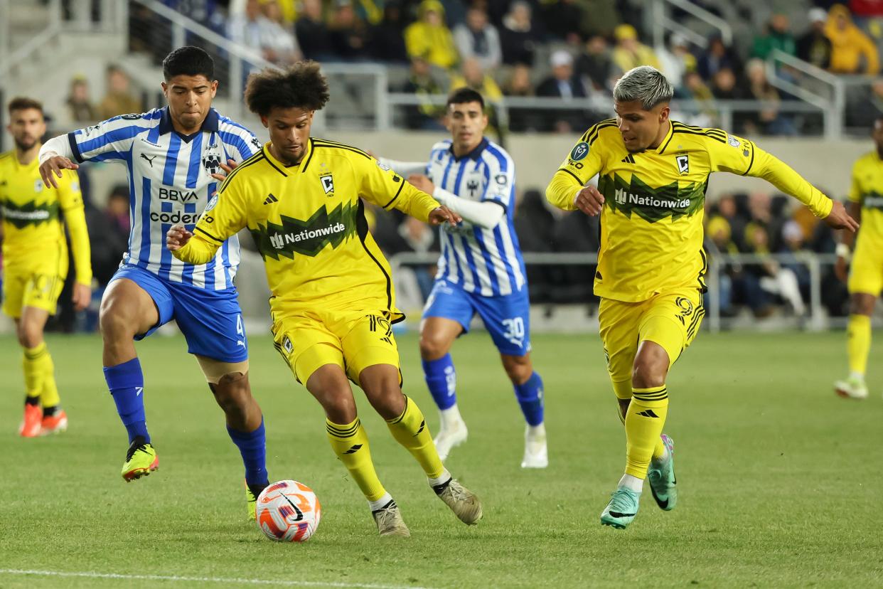 Crew forwards Jacen Russell-Rowe (19) and Cucho Hernandez (9) move the ball into the box past CF Monterrey defender Victor Guzman (4).