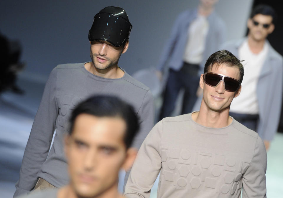 Models wear creations for Emporio Armani men's Spring-Summer 2014 collection part of the Milan Fashion Week, unveiled in Milan, Italy, Monday, June 24, 2013. (AP Photo/Giuseppe Aresu)