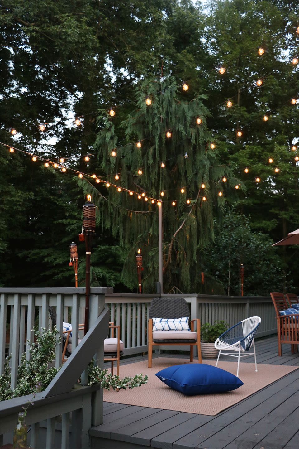 <p>It's always a starry night when you hang string lights above your back patio. You'll want to wind down in this pleasant place every day of the week.</p><p><strong>See more at <a href="https://rootanddwell.com/blog/2018/7/5/how-we-hung-our-back-deck-string-lights-for-bistro-style-ambiance" rel="nofollow noopener" target="_blank" data-ylk="slk:Root + Dwell;elm:context_link;itc:0;sec:content-canvas" class="link ">Root + Dwell</a>.</strong></p><p><a class="link " href="https://www.amazon.com/Backyard-Hanging-Outdoor-Pergola-Deckyard/dp/B00RQHBZVS/ref=sr_1_12?tag=syn-yahoo-20&ascsubtag=%5Bartid%7C10050.g.3404%5Bsrc%7Cyahoo-us" rel="nofollow noopener" target="_blank" data-ylk="slk:SHOP STRING LIGHTS;elm:context_link;itc:0;sec:content-canvas">SHOP STRING LIGHTS</a></p>