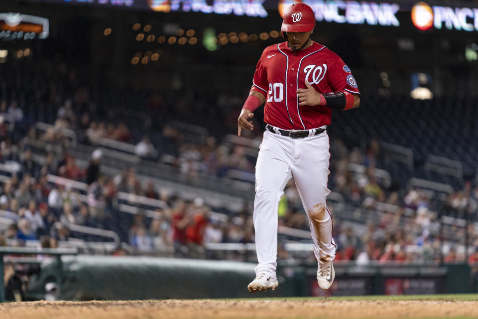 Washington Nationals' Keibert Ruiz advances toward home base to score on a single RBI hit in by Nationals' Luis Garcia during the third inning of the second game of a baseball doubleheader against the Atlanta Braves, Sunday, Sept. 24, 2023, in Washington. (AP Photo/Stephanie Scarbrough)