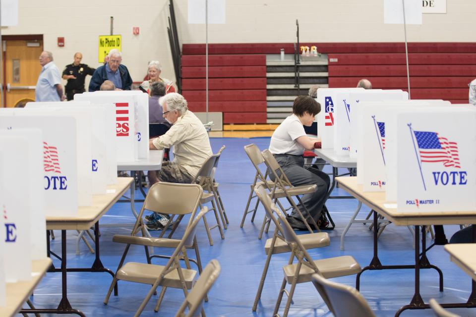 Voters fill out their ballots at Bedford High School during the New Hampshire Primary on September 13, 2022 in Bedford, New Hampshire.