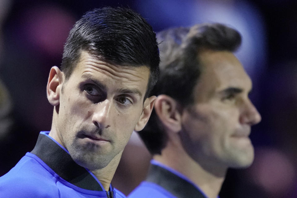 Team Europe's Novak Djokovic and Roger Federer line up on second day of the Laver Cup tennis tournament at the O2 in London, Saturday, Sept. 24, 2022. (AP Photo/Kin Cheung)