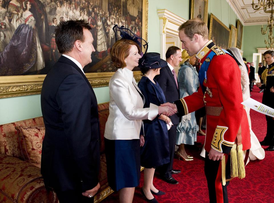 Prince William shakes hands with prime minister of Australia Julia Gillard at his wedding.