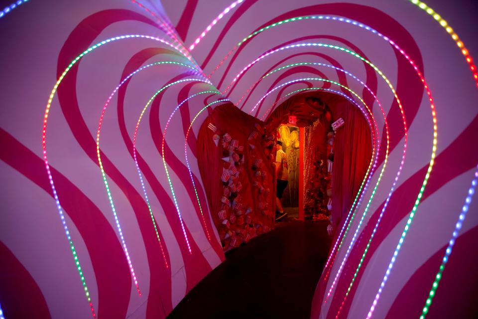 Visitors walk through a hallway inside Factory Obscura's "Mix-Tape" experience in Oklahoma City, Saturday, Sept. 21, 2019.