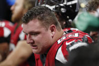 FILE - In this Aug. 15, 2019 file photo, Atlanta Falcons offensive guard Chris Lindstrom (63) sits on the bench during the first half an NFL preseason football game against the New York Jets in Atlanta. After being limited by a foot injury to only five games in his rookie season, Lindstrom is being counted on to be a fixture at right guard and provide better protection for quarterback Matt Ryan in 2020. (AP Photo/John Bazemore, File)