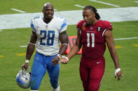 Arizona Cardinals wide receiver Larry Fitzgerald (11) talks with Detroit Lions running back Adrian Peterson (28) after an NFL football game, Sunday, Sept. 27, 2020, in Glendale, Ariz. The Lions won 26-23. (AP Photo/Ross D. Franklin)