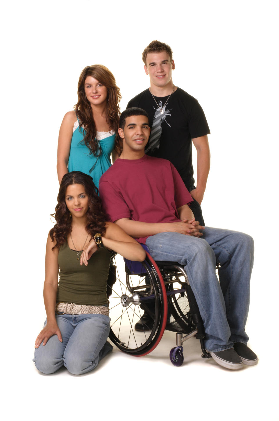 Melissa McIntyre, Shenae Grimes, Shane Kippel, and Drake in <em>Degrassi: The Next Generation.</em> (Photo: CATV/Courtesy Everett Collection)