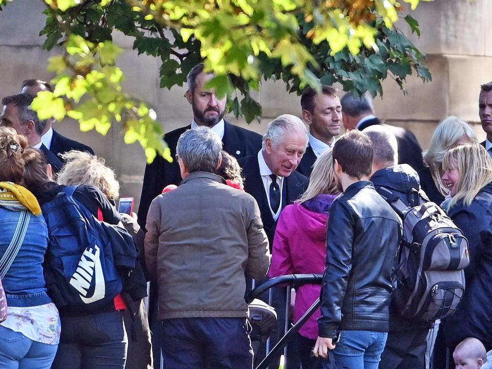 King Charles III talks to wellwishers, before accompanying the cortege carrying the coffin of Queen Elizabeth II in procession to St Giles' Cathedral