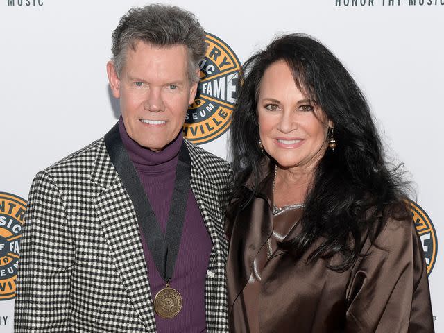 <p>Jason Kempin/Getty</p> Randy Travis and Mary Davis attend the 2019 Country Music Hall of Fame Medallion Ceremony on October 20, 2019 in Nashville, Tennessee.