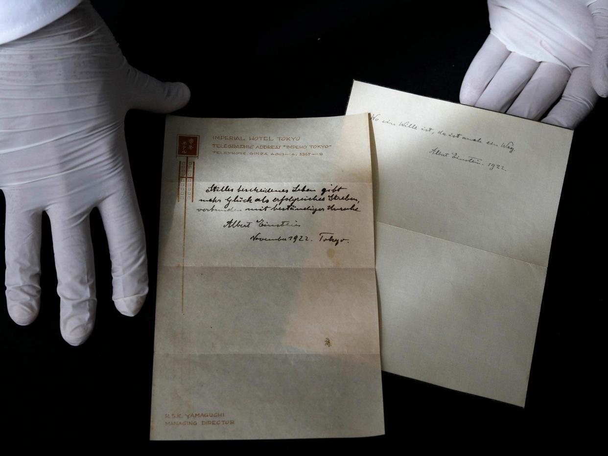 Two notes written by Albert Einstein briefly describing his theory on happy living: MENAHEM KAHANA/AFP/Getty Images