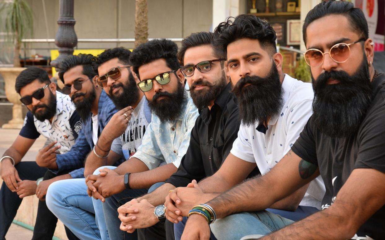 A group of men with beards pose for a photograph at a beard competition in Bangalore - AFP or licensors
