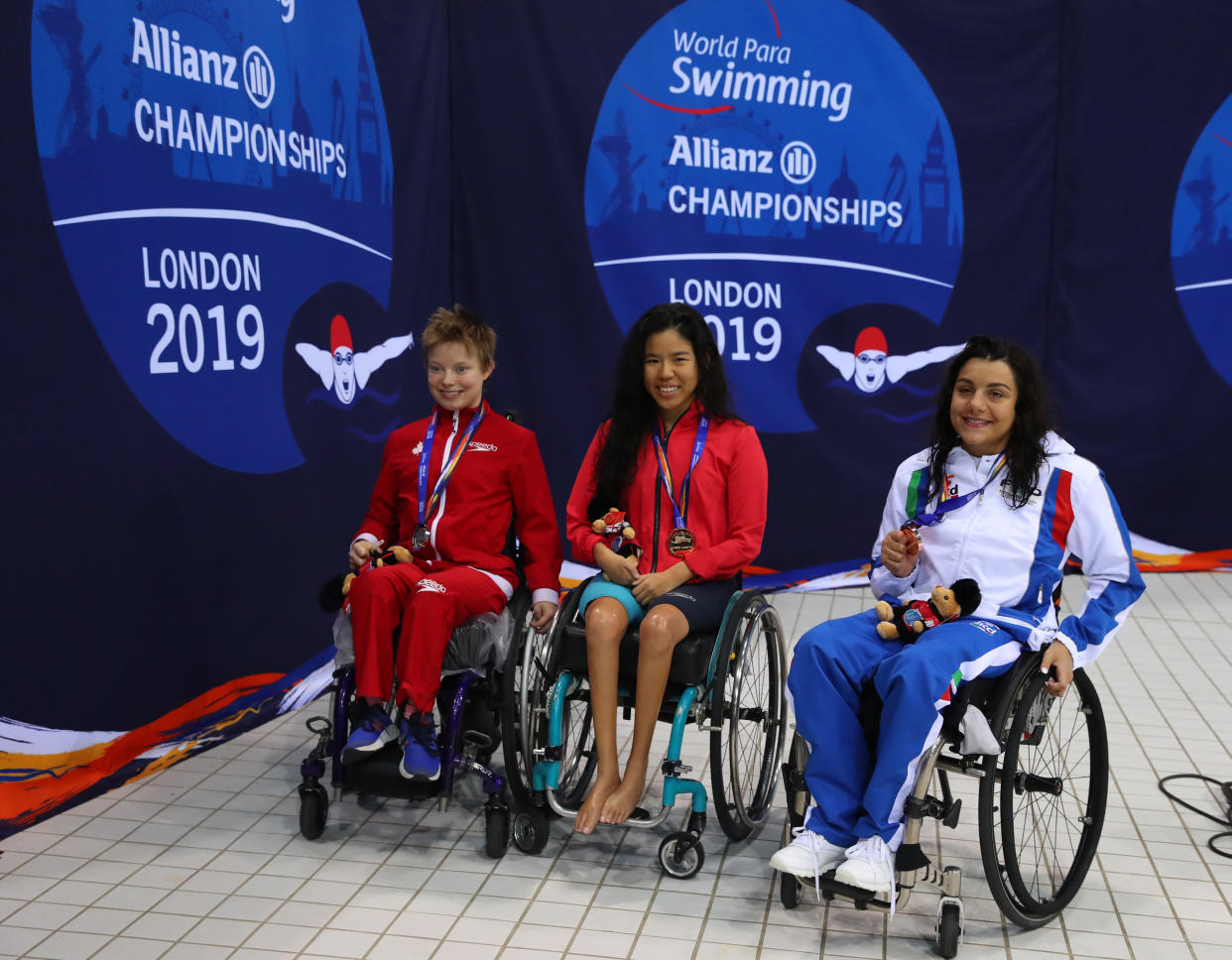 LONDON, ENGLAND - SEPTEMBER 11:  Pin Xiu Yip (gold)  Aly van Wyck-Smart (silver) of Canada and Angela Procida of Italy (bronze) after the Women's 100m Backstroke S2 Final  on Day Three of the London 2019 World Para-swimming Allianz Championships  at Aquatics Centre on September 11, 2019 in London, England. (Photo by Catherine Ivill/Getty Images)