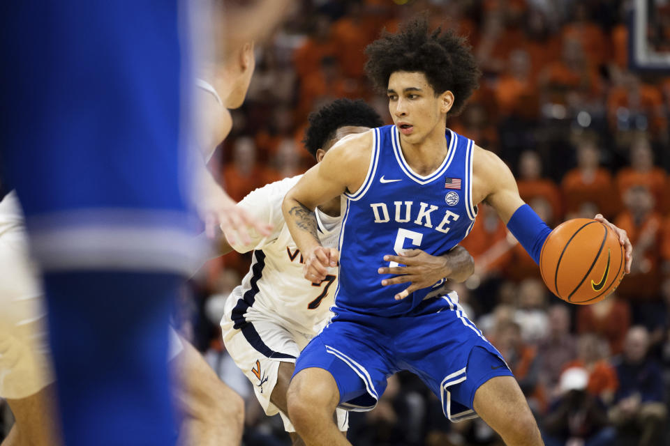 Duke's Tyrese Proctor (5) defends the ball against Virginia during the first half of an NCAA college basketball game in Charlottesville, Va., Saturday, Feb. 11, 2023. (AP Photo/Mike Kropf)