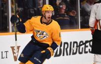 Nov 25, 2018; Nashville, TN, USA; Nashville Predators center Nick Bonino (13) celebrates after a goal by Nashville Predators right wing Craig Smith (not pictured) during the third period against the Anaheim Ducks at Bridgestone Arena. Mandatory Credit: Christopher Hanewinckel-USA TODAY Sports