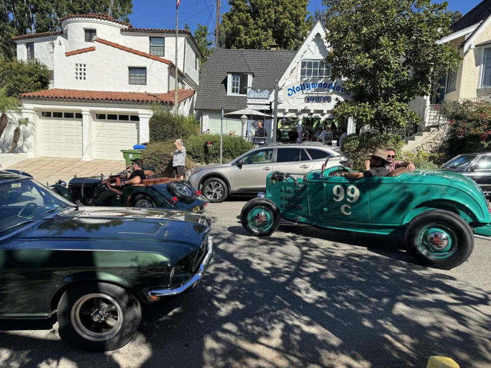 a group of cars parked on the side of a road