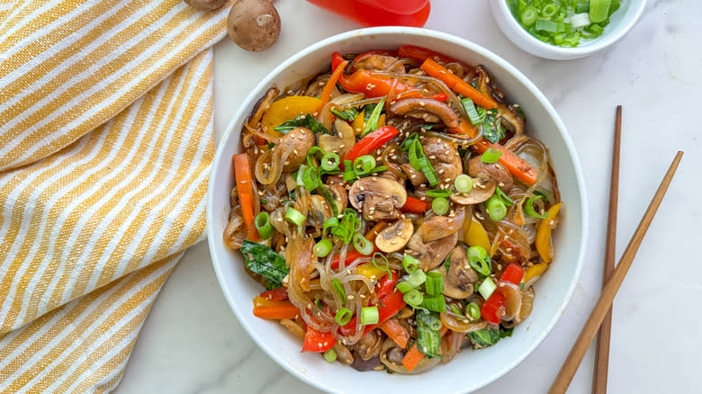 japchae in white bowl