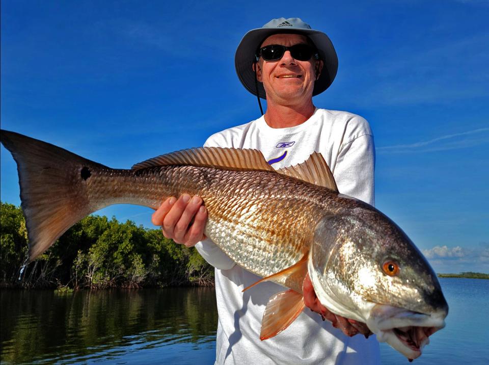 Tony McGowan, of Lino Lakes, Minnesota, caught this 34-inch redfish on a life shrimp while fishing in Ozello with Capt. Marrio Castello, of Tall Tales Charters this week. 