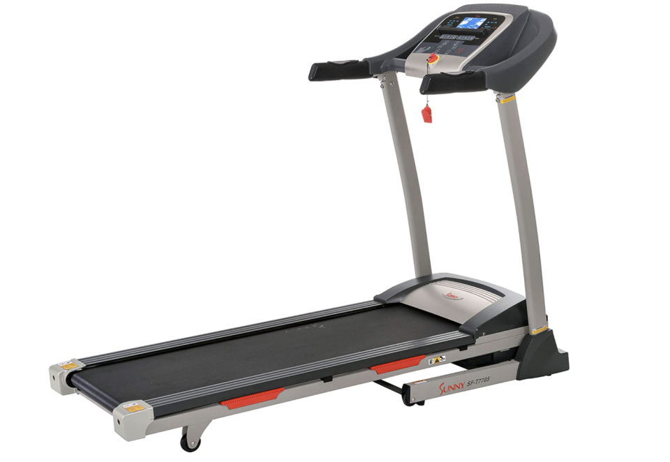 Grey treadmill with digital screen and black belt.