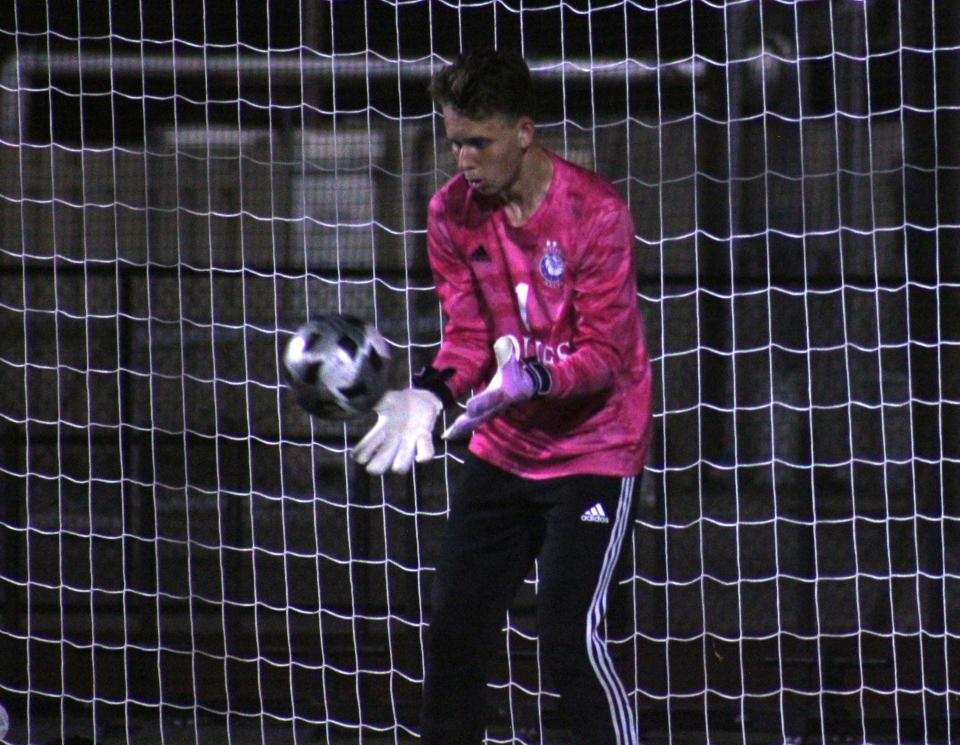 Bolles goalkeeper Lincoln Hunt (1) catches a shot in warmups. The Bulldogs are aiming for a return trip to the state final four.