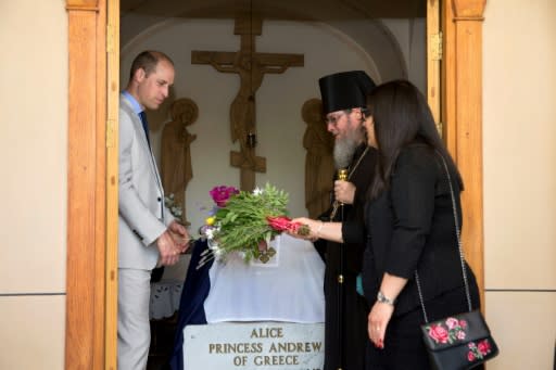 Britain's Prince William lays flowers at the grave of his great-grandmother Princess Alice of Battenberg during a visit to the Mary Magdalene Church, in east Jerusalem, on June 28, 2018