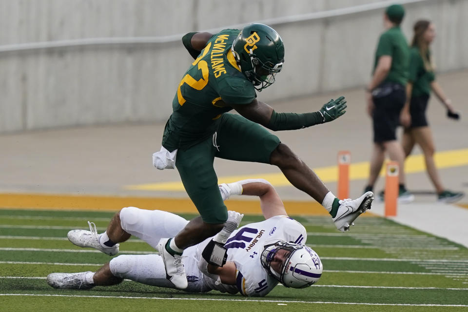 Baylor running back Taye McWilliams (22) breaks a tackle by Albany linebacker AJ Mistler (41) during the first half of an NCAA college football game in Waco, Texas, Saturday, Sept. 3, 2022. (AP Photo/LM Otero)