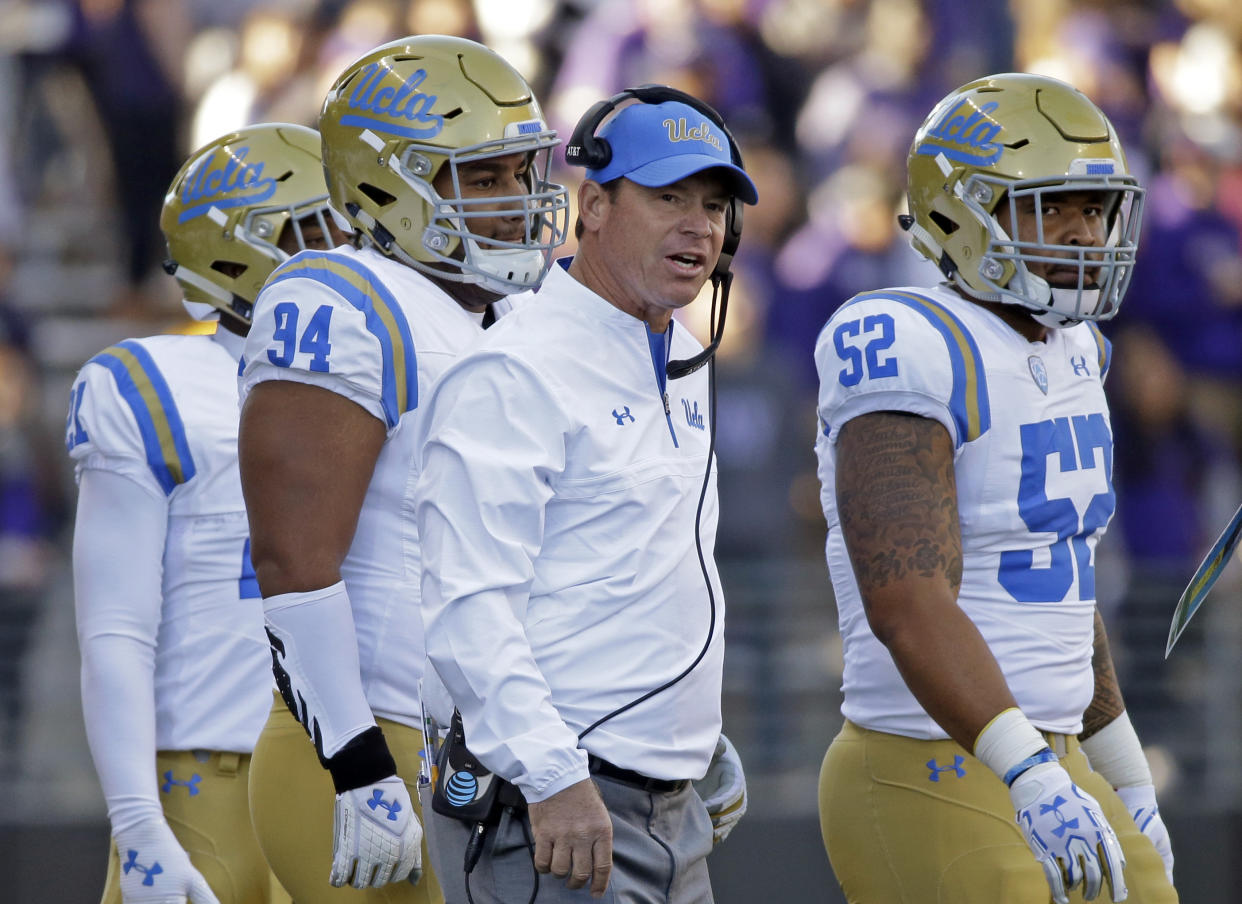 UCLA head coach Jim Mora looks toward the field against Washington in the first half of an NCAA college football game Saturday, Oct. 28, 2017, in Seattle. (AP Photo/Elaine Thompson)