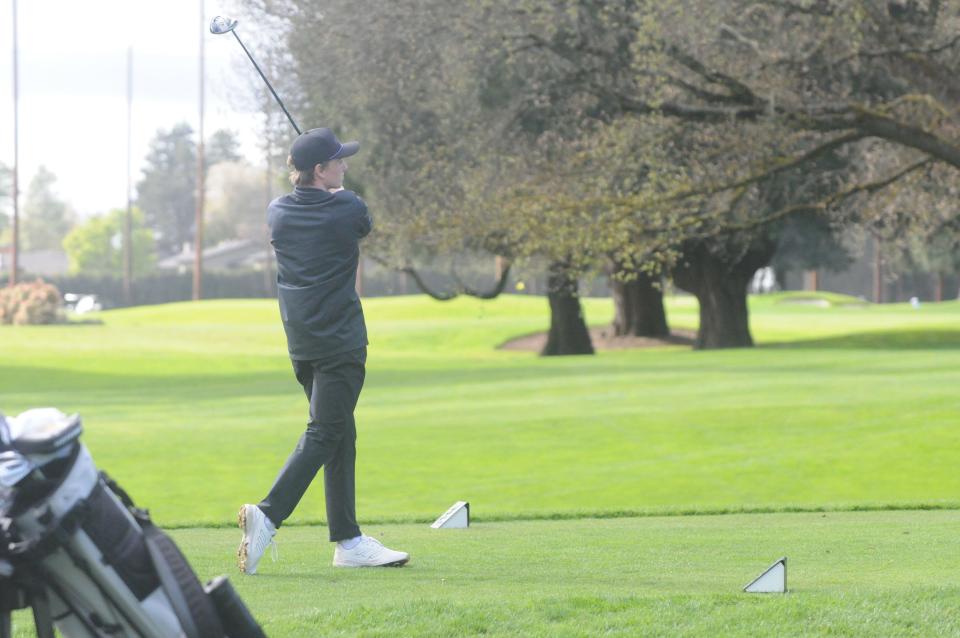 South Eugene's Owen Davis-Piger tees off in the boys high school invitational at Eugene Country Club in Eugene on April 15, 2024.