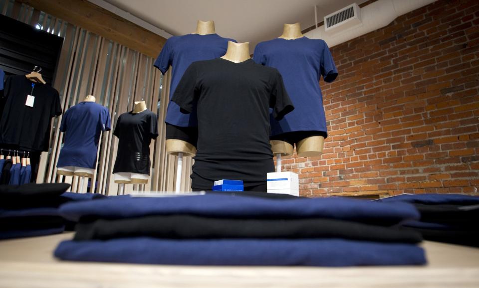 Products are displayed at the Kit and Ace flagship store in Vancouver, British Columbia October 17, 2014. Kit and Ace is the brainchild of billionaire Chip Wilson's wife, former Lululemon lead designer Shannon Wilson, who started the new streetwear venture with his son J.J. Backed entirely by Wilson family money, Kit and Ace has started with one store in the heart of Vancouver's artsy Gastown neighborhood. The shop specializes in "technical" luxury: cashmere-blend casual wear that is pre-shrunk, washable and durable. Picture taken October 17, 2014. REUTERS/Ben Nelms (CANADA - Tags: BUSINESS FASHION)