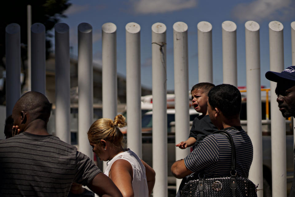 <p>Undocumented migrants wait for asylum hearings outside of the port of entry in Tijuana, Mexico on Monday, June 18, 2018. The Trump administration will no longer accept victims of domestic abuse or gang violence seeking asylum. (Photo: Sandy Huffaker/Getty Images) </p>