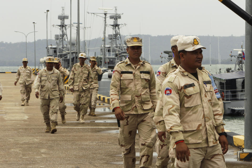 Cambodian navy troop members walk at Ream Naval Base in Sihanoukville, southwestern of Phnom Penh, Cambodia on July 26, 2019. Cambodia's government on Monday, Oct. 5, 2020, officially denied suggestions that its demolition of a U.S.-funded facility at one of its naval bases is a signal that China will be granted basing privileges there, saying the work only involves planned infrastructure improvements.(AP Photo/Heng Sinith)